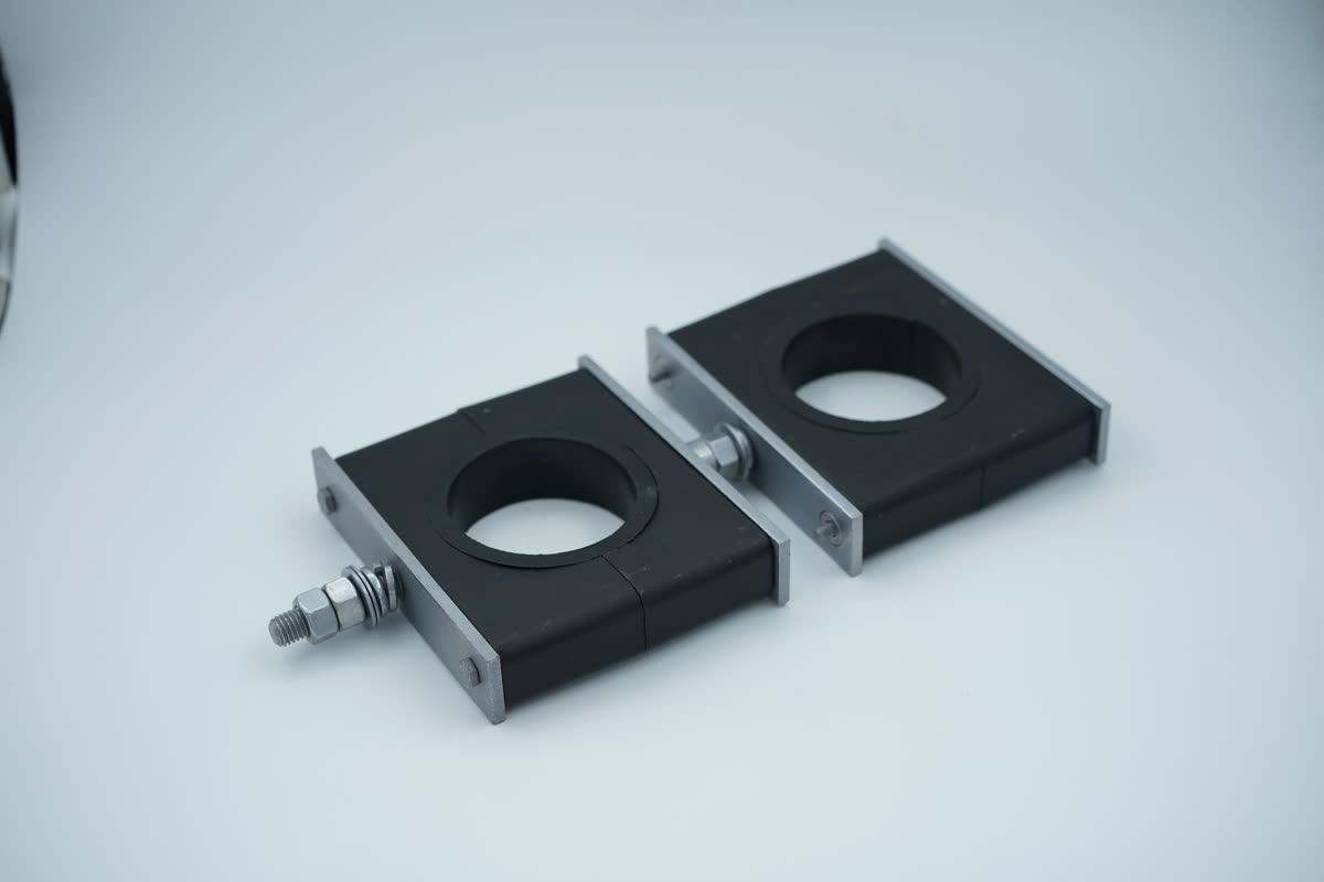 Orientable swivel wind turbine clamp pair with zinc-nickel bracket